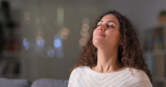 woman taking deep breath