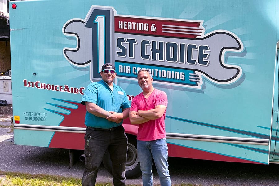 1st Choice Air Conditioning team standing by their service truck