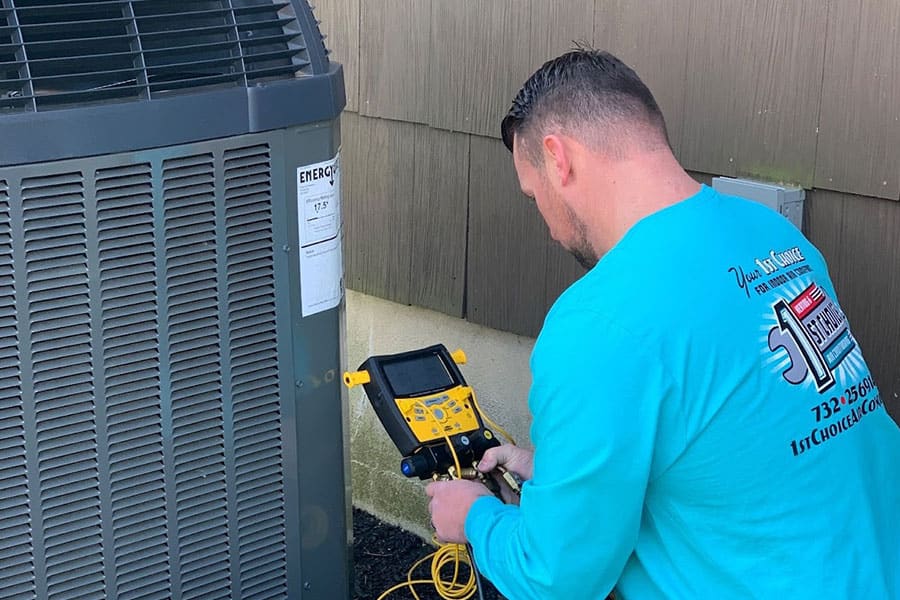 Outdoor AC unit being tested during a residential repair service in Colts Neck Township, NJ